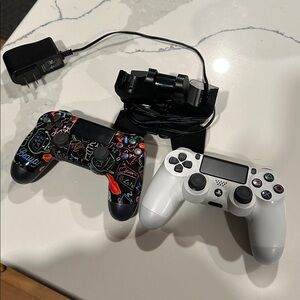 Two PS4 Controllers with charging stand